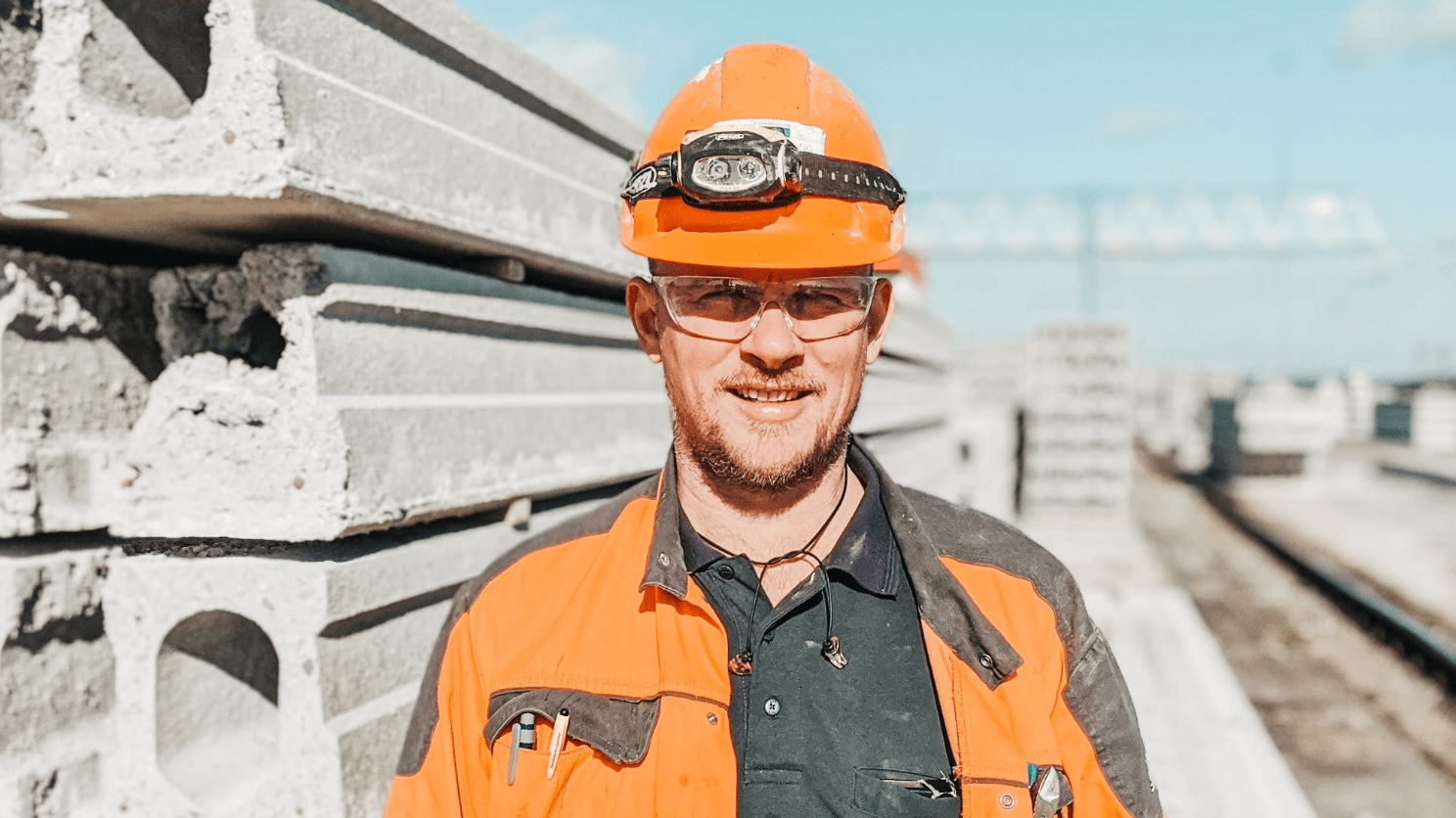 construction worker in hardhat laughing with coworker